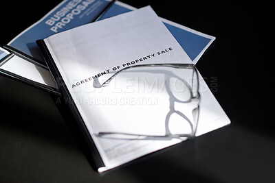 Buy stock photo Real estate, property agreement and document with above, title transfer or contract in seller transaction. Offer, glasses and papers with approval, mortgage clause or bond rights in buyer obligation.