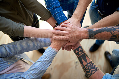 Buy stock photo Top view, team building and stack hands in office for cooperation, synergy and community support. Above, group and business people with pile for collaboration, solidarity and connection together