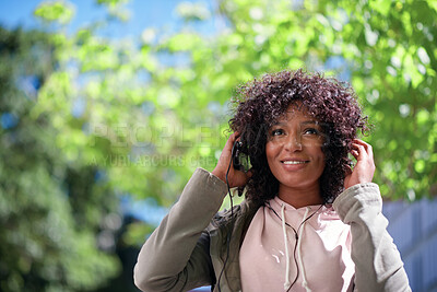 Buy stock photo Happy, streaming or black woman in city with headphones, song connection or listening to music playlist. Smile, digital or female person with tech, feeling beat or radio subscription on audio app.