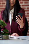 business woman holding smartphone browsing reading information on mobile phone