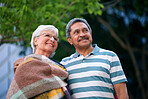 happy old couple smiling in city street enjoying retirement