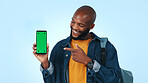 Green screen, student and happy man with phone, portrait and recommendation for social media or web. Blue background, marketing and person with smile for mobile, promotion and technology in studio