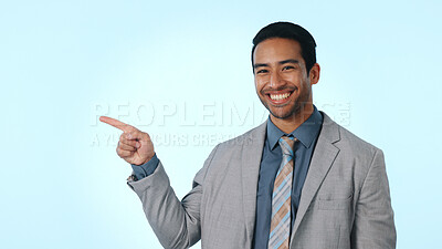 Buy stock photo Pointing, happy and portrait of businessman in studio with option or choice for finance career growth. Space, professional and financial manager with decision for job opportunity by blue background.