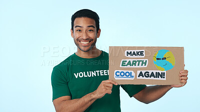 Buy stock photo Volunteer, poster and portrait of man in studio for climate change, conservation and global warming. Space, happy and person with sign for earth day, ecology and recycling campaign on blue background