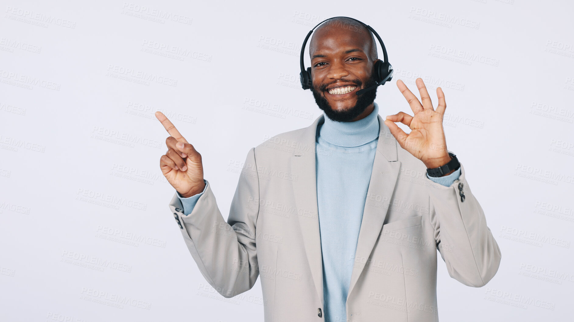 Buy stock photo Black man, portrait or pointing with headset for business advertising on a studio background. Businessman, agent or smile with OK sign for good customer service, CRM advice or helpful tips on space