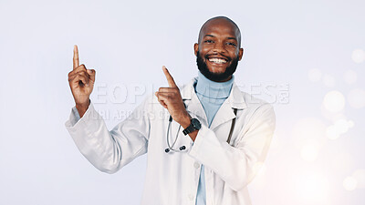 Buy stock photo Hospital, pointing and portrait of doctor in studio for medical news, advice and healthcare service. Bokeh, space and black man with gesture for medicine, clinic info or wellness on white background