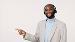 Black man, portrait and consultant pointing with headset for advertising on a studio background. Businessman, agent or smile with mockup space for customer service help, telemarketing advice or tips