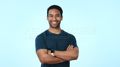 Buy stock photo Fitness, happy and portrait of man in studio with pride for exercise, workout progress or results. Space, mockup and person with crossed arms for health, wellness or gym membership on blue background