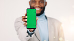 Green screen, portrait and happy man with phone, marketing and recommendation for social media app. White background, online and black person with smile for mobile, promotion and technology in studio