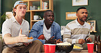 Men, snacks and watching tv in home with sports match, entertainment and frustrated for game foul. Friends, stress and football broadcast in living room with competition loss, concern and suspense.
