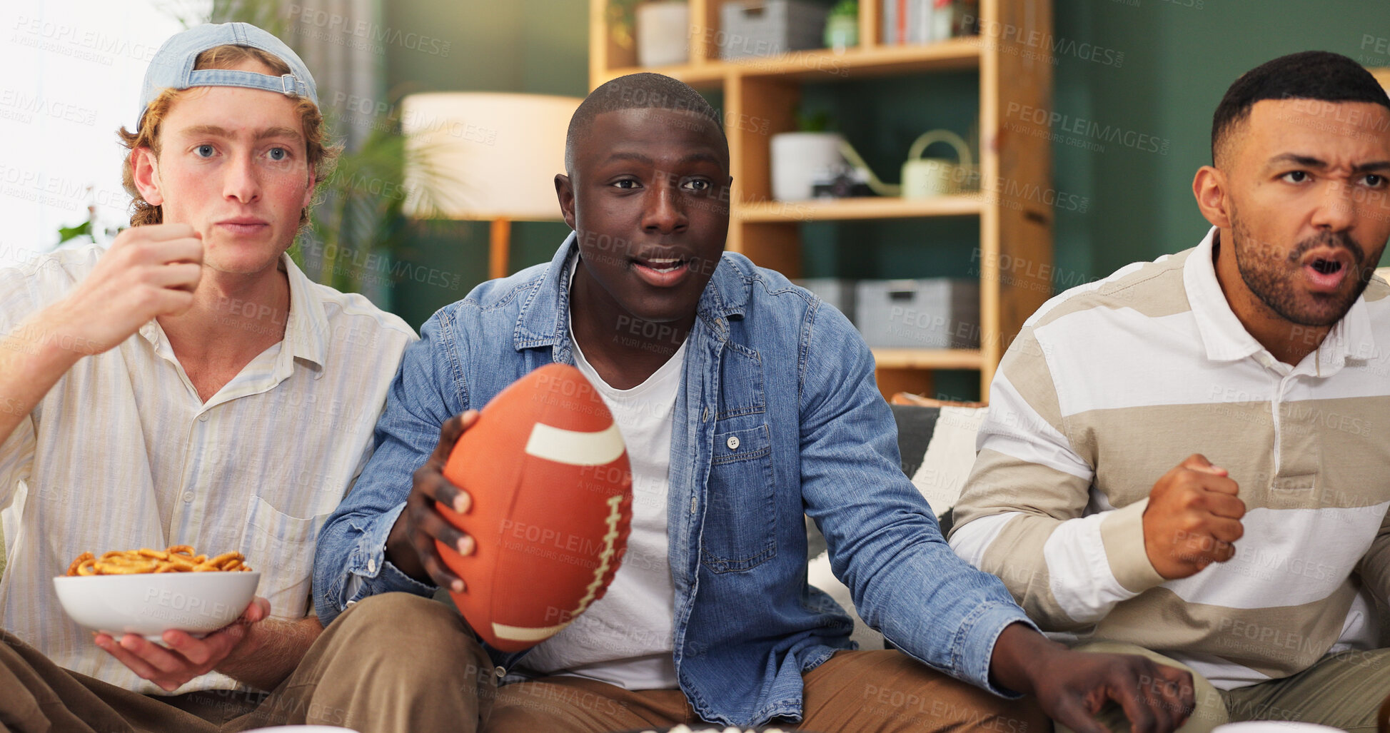 Buy stock photo Men, snacks and watching tv in house with sports game, entertainment and suspense for competition. Friends, stress and eating together in lounge with American football, broadcast and match pressure.