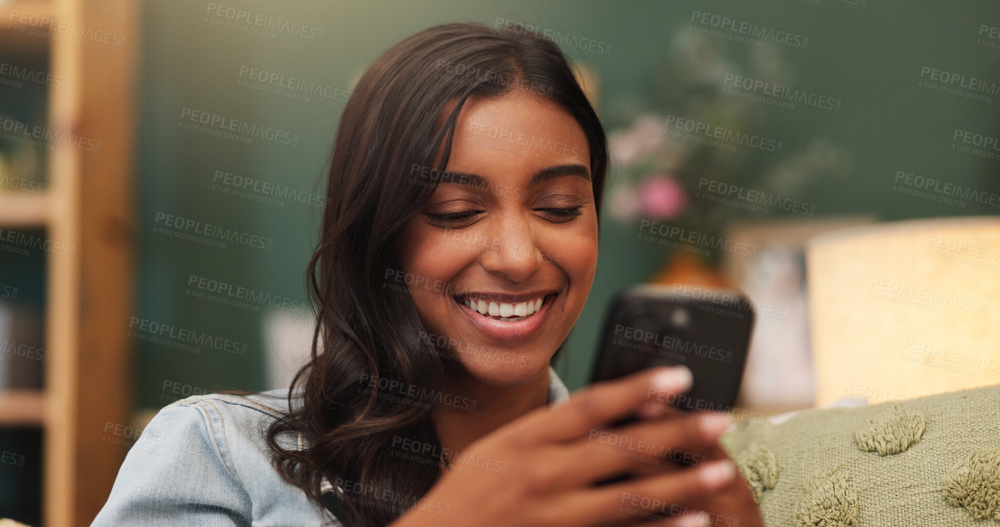 Buy stock photo Woman, smile and chill in apartment with phone, online dating notification and reading text message. Happy, person and relax in house with tech, mobile app and social media for digital communication.