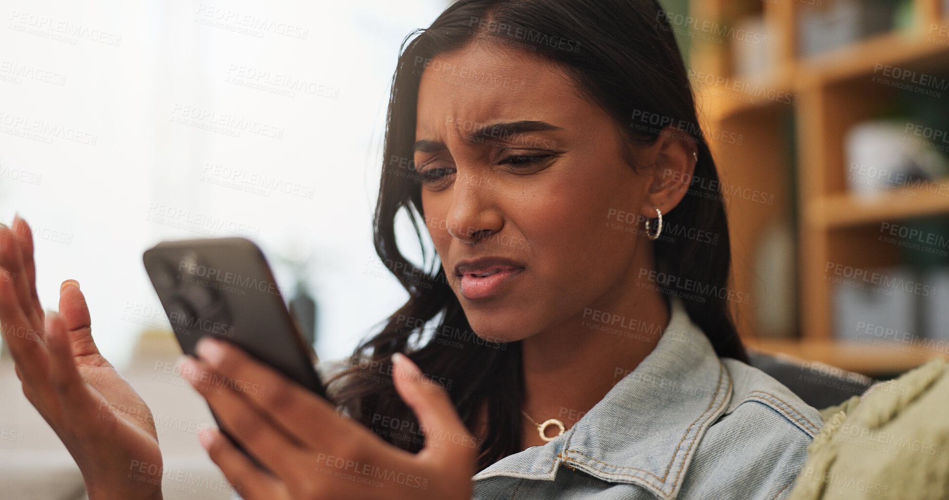 Buy stock photo Confused, upset and woman with phone in home for texting, networking or communication on mobile app. Technology, bad news and female person with cellphone for contact or chatting in living room.