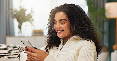Buy stock photo Woman, smile and chill in living room with phone, online dating notification and reading text message. Happy, person and relax in house with tech, mobile app and internet for digital communication.