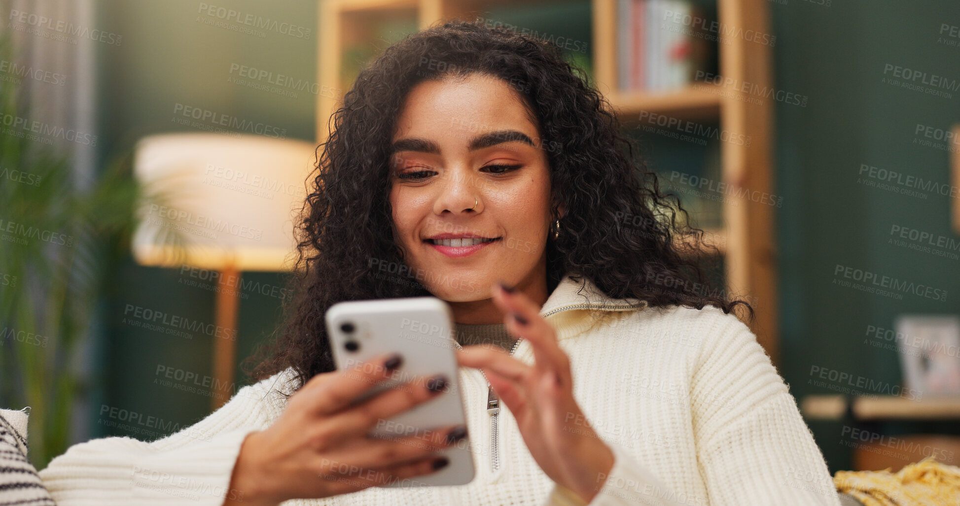 Buy stock photo Happy, woman and texting with smartphone in home, reading and communication with contact on website. Typing, message and person with mobile app for chat, online and smile with tech in living room