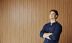 Thinking, smile or man in office with arms crossed, mindfulness or inspiration for career growth. Reflection, space or employee in agency with idea, perspective or daydreaming on professional goals