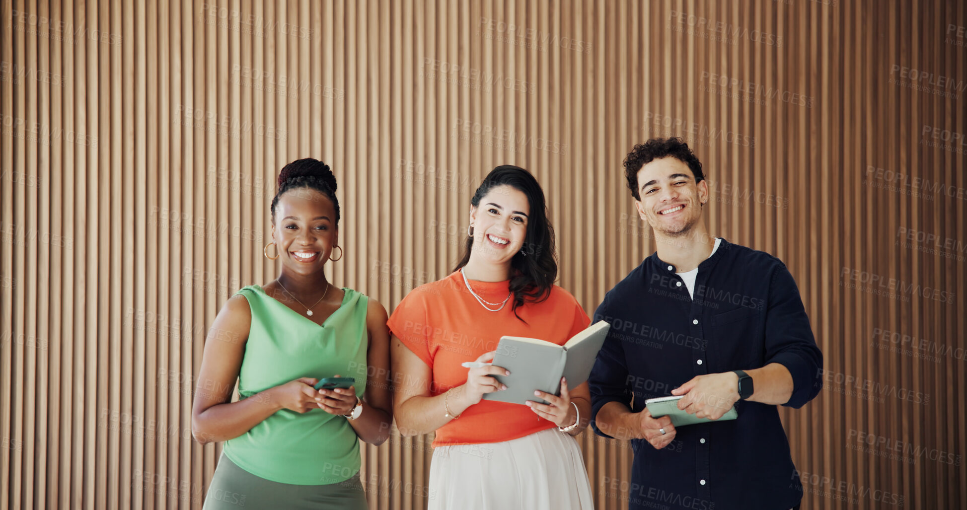 Buy stock photo Happy people, team or portrait with wooden background of creative agency for career opportunity. Group, employees or colleagues with smile, book or phone for network or about us together in workplace