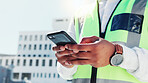 Hands, architect and typing with phone outdoor for research, contact client and building design. Contractor, reading and mobile for online blueprint, schedule update and information on infrastructure
