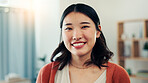 Happy, smile and portrait of Asian woman in home with positive attitude, good mood and confidence. Homeowner, apartment and person in living room for calm on break, weekend and relax for me time