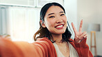 Happy woman, portrait and selfie with peace sign in home, profile picture or memory for social media. Influencer, online and Asian person with smile for image, photography and vlog with gesture