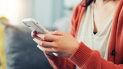 Buy stock photo Home, typing and hands of woman with phone on sofa for social media, online chat and notification. Apartment, scroll and person on smartphone for connection, communication and message on mobile app