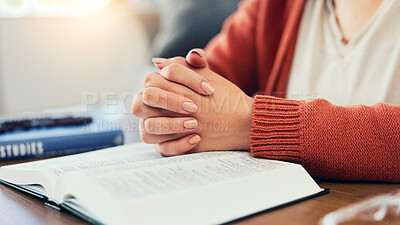 Buy stock photo Paying, bible and hands of woman home for religion, worship and belief for routine with book. Christianity, religious and person in prayer for peace, blessings and gratitude for learning holy script