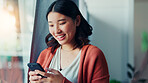 Laugh, typing and Asian woman with phone in home for social media, online meme and notification. Smile, happy and person on smartphone for connection, communication and funny message on mobile app