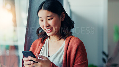 Buy stock photo Laugh, typing and Asian woman with phone in home for social media, online meme and notification. Smile, happy and person on smartphone for connection, communication and funny message on mobile app