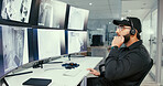Security, control room and man with headset by monitor for communication, surveillance or report. Safety officer, computer screen and technology to talk about security breach, inspection or dispatch