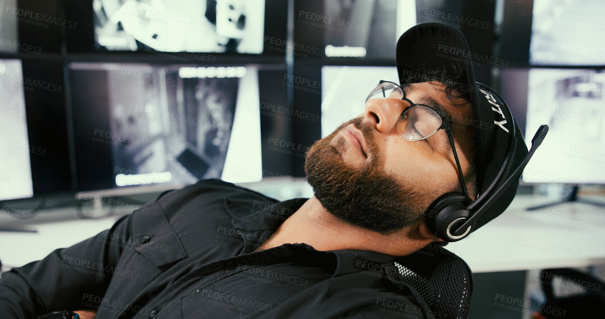 Buy stock photo Man, security guard and sleep with monitor for surveillance job, tired or glasses on overtime. Person, headset and safety control officer with fatigue, burnout or rest by screen for crime prevention