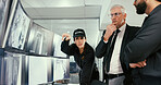 Monitor, manager or security guard with pointing in control room, video footage or check cctv blind spot. Computer screen, talk or team meeting for surveillance weak point, building safety or people