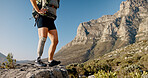 Woman, hiker or mountain with prosthetic leg for mobility, outdoor workout or muscle rehabilitation. Hiking, rock and person with a disability on cliff for trekking journey, adventure or exercise