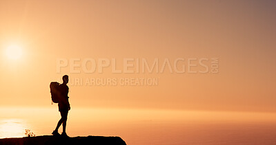 Buy stock photo Sunset, hiking and man on mountain for adventure, mockup space and sightseeing on holiday or travel. Outdoor, sky and person with scenery in nature, silhouette and break on vacation for exploration
