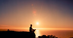 Sunrise, meditation and man on mountain by sea for reflection, mindfulness and peace in morning. Silhouette, nature and person with calm for mental health, wellness and balance with horizon space