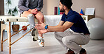Physiotherapist, amputee and leg with people, talk and rehabilitation for person with disability. Healthcare, help or consultation for medical prosthetic, physical therapy or man with woman in clinic