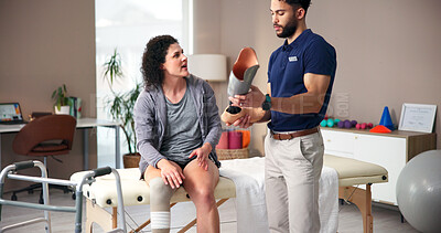 Buy stock photo Physiotherapist, talking and leg with people, advice and rehabilitation for person with disability. Health, checkup or consulting for medical prosthetic, physical therapy or man with woman in clinic
