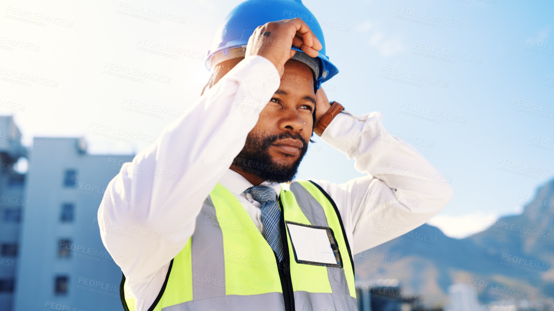 Buy stock photo Black man, architect or ready with helmet in city for building, construction or security. Determined, male person or civil engineer with hard hat or preparation for architecture on site in urban town