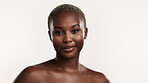 Portrait, smile and black woman in studio with skincare, confidence and collagen for antiaging benefits. Happy, female person and beauty with dermatology, healthy skin and space on white background.