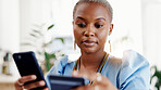 Black woman, credit card and phone at office with online shopping, fintech and easy payment. African person, budget and transaction for ecommerce, bills or mobile app for customer experience on web