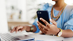 Hands, laptop and typing with phone at office with review, contact or project at media company. Person, tech and click with computer, notification and mobile app for feedback at creative agency