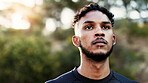 Exercise, sports and thinking with man outdoor for start of cardio training or workout routine. Fitness, planning and vision with runner in nature for challenge, physical improvement or wellness