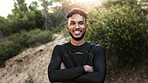 Happy man, portrait and fitness with confidence in nature for outdoor exercise or workout. Active, male person or runner with smile or arms crossed for physical activity, health or wellness in forest