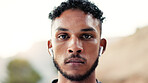 Portrait, man and sweating outdoor with exercise break, earphones and training recovery for wellness. Space, serious person and athlete with cardio workout rest, fitness and audio tech for cool down.