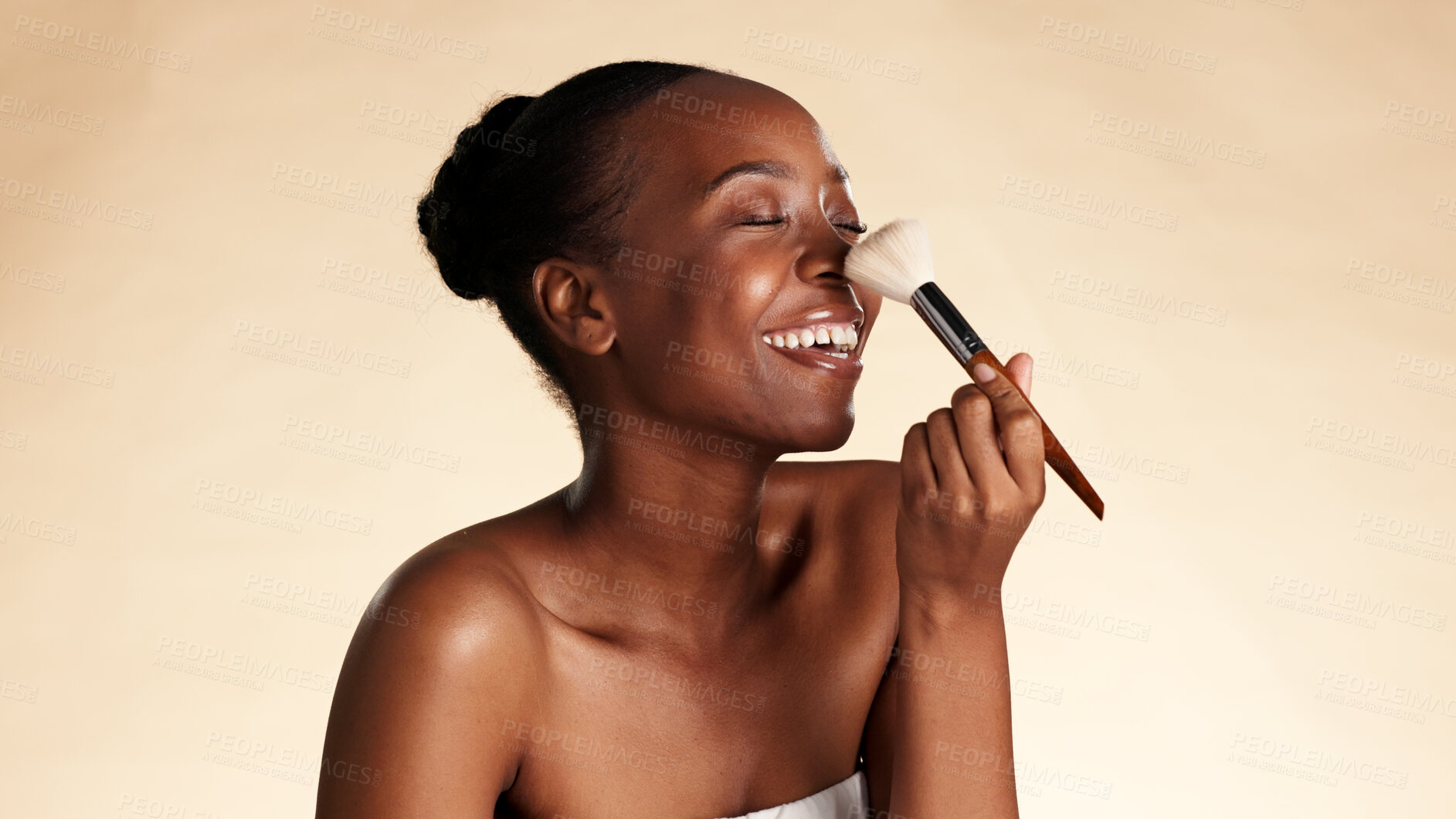 Buy stock photo Smile, makeup and brush with black woman in studio for cosmetics, powder and glow. Concealer, foundation and space with African person for cosmetology, beauty aesthetic or blush on background