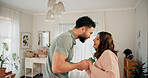Happy, dancing and couple in home for bonding, love or connection with music on weekend break. Smile, care and man with woman for groove to radio with rhythm together in marriage at apartment.