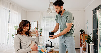 Buy stock photo Nauseous, pregnant woman and man in home, tea and rejection with stomach pain, sick and illness. Uncomfortable, husband and wife with pregnancy, liquid to induce labour and conversation for wellness