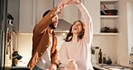 Laugh, dance and couple in kitchen for love, anniversary celebration or happiness with partner. Spin, funny woman and man in home with music, holding hands or romantic rhythm for healthy relationship