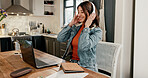 Woman, home and listening to music for remote work, creative and streaming with headphones on break. Happy, freelancer and person with laptop for digital project, online and audio with tech in house