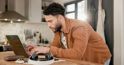 Buy stock photo Laptop, typing and man in kitchen for remote work, review article or proposal with email in home. Computer, freelance journalist and person reading information, research or fact check for news story