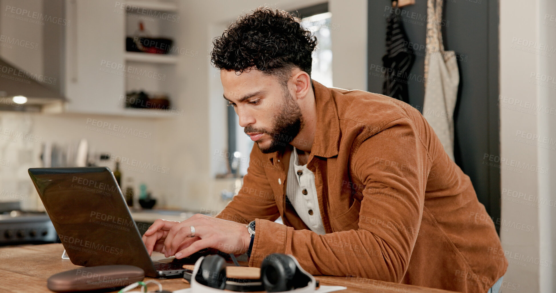 Buy stock photo Laptop, typing and man in kitchen for freelance, review article or proposal with email in home. Person, remote work and journalist on computer for reading info, research or fact check for news story
